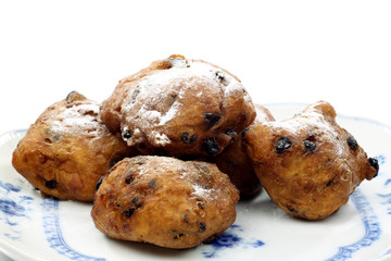freshly baked dutch traditional oliebollen with currents