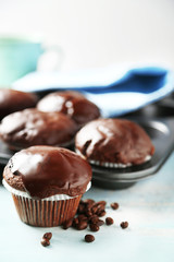 Tasty homemade chocolate muffins and cup of coffee