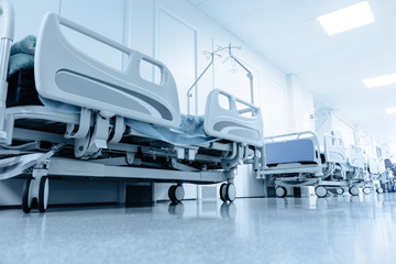 long corridor in hospital with surgical beds. - 78644812