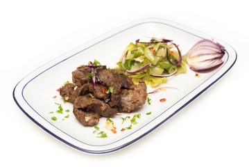 Agnello in salsa con contorno di cavolo e spezie