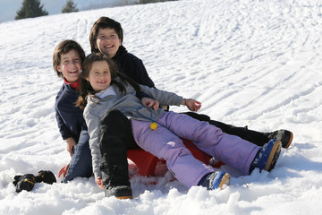 Fototapeta na wymiar Three brothers on the snow in the mountains