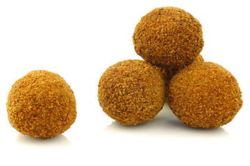 traditional Dutch snack called "bitterballen" on a white backgro