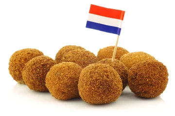 Keuken spatwand met foto traditional Dutch snack called "bitterballen" with a Dutch flag © tpzijl