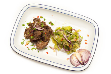 Agnello in salsa con contorno di cavolo e spezie