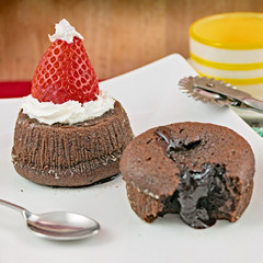 Chocolate cake with strawberry in the shape of hat Christmas