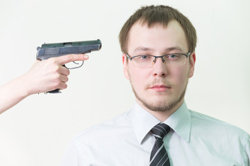 to kill  man with  pistol in shirt and tie