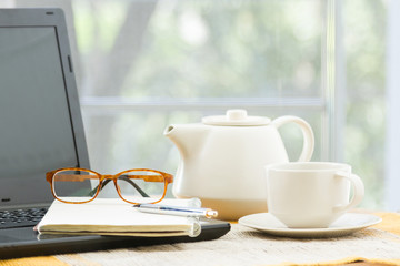Wooden table with office supplies
