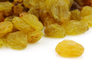 dried white raisins on a white background