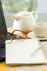 Wooden table with office supplies