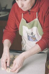 Young woman chef cooking cake in kitchen