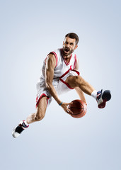 Naklejka premium Basketball player is spinning on his finger