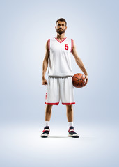 Fototapeta premium Basketball player is spinning on his finger
