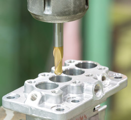 operator machining automotive parts by machining center