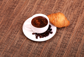 Cup of coffee with coffee beans