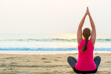 Fototapeta na wymiar yoga in the fresh air on the beach