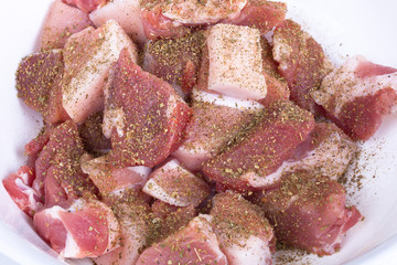 Raw meat for barbecue with onion and spices on light background