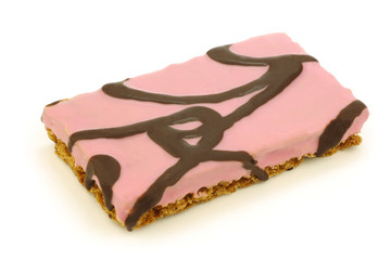 freshly baked pink glazed cookie with chocolate dressing