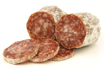 spicy Italian salami sausage on a white background