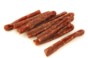 traditional frisian dried sausage sticks on a white background