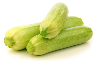 light green zucchini (Cucurbita pepo) on a white background