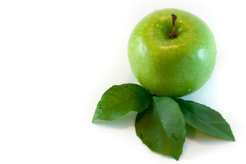 Green apple with leaves, isolated