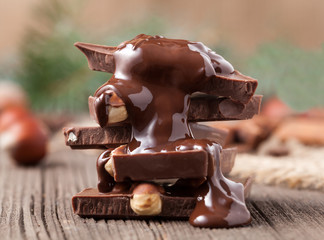 Stack of melted chocolate with nuts