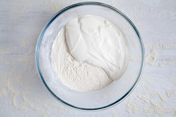Dough preparation. Ingredients for dough in bowl