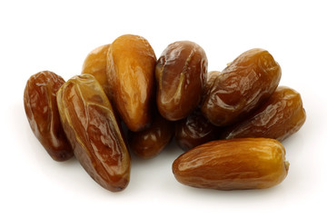 bunch of date fruit on a white background