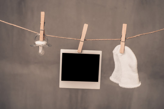 Baby goods blank photo hanging clothesline