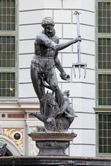 Fountain from Neptune statue on old city in gdansk. © Alina G