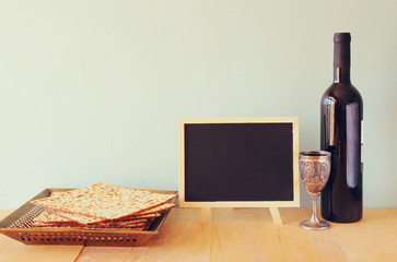 Passover background. wine and matzoh (jewish passover bread) ove