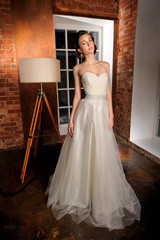 Fototapeta premium Full-length beautiful Bride in wedding dress. Studio.