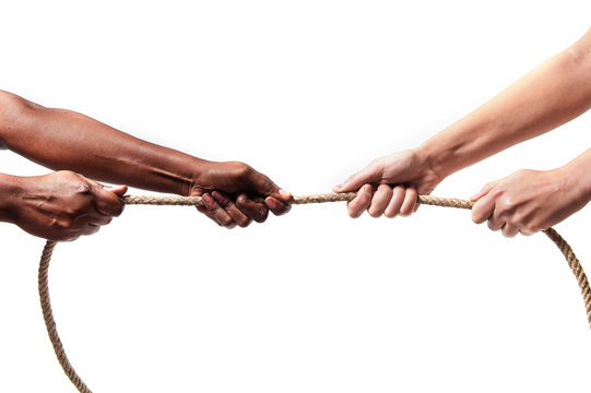 black ethnicity hands pulling rope against Caucasian stop racism