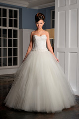 Fototapeta premium Full-length beautiful Bride in wedding dress. Studio.