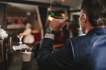 Hands of the groom while wearing watches