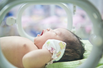 newborn baby in Incubator care at nursery
