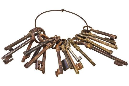 Set of vintage rusty keys on a ring isolated on white