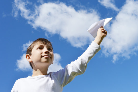 Child playing with airplane