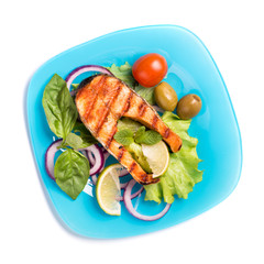 Grilled salmon on blue plate isolated