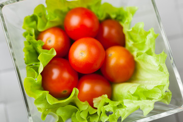 fresh vegetables on plate, grey place mat background