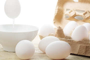 blow out white egg for Easter decoration, eggs in a carton and o