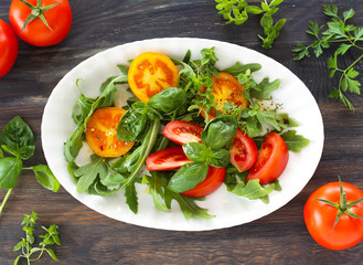Tomatoes with rocket and basil