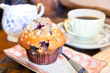 Hot coffee with chocolate cup cake on wooden table