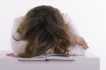 Frustrated  student sleeping on the book