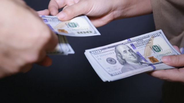 Close up of paying cash
