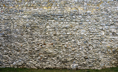 Ancient stone wall of the castle. texture of rough stone
