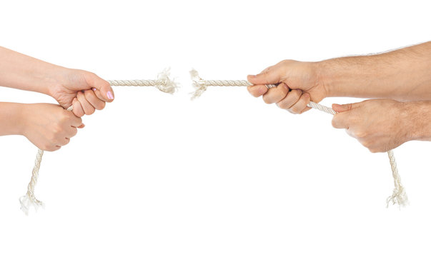 Man and woman hands with breaking rope