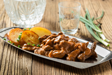 Beef Stroganoff, strips of beef in sour cream served with crisp