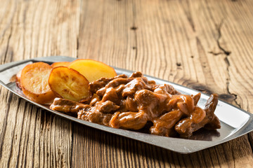Beef Stroganoff, strips of beef in sour cream served with crisp