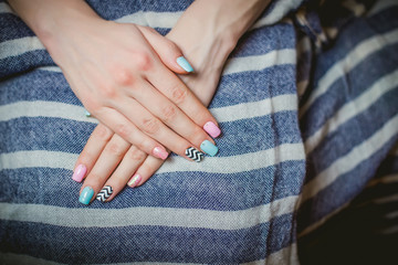 girl shows blue manicure